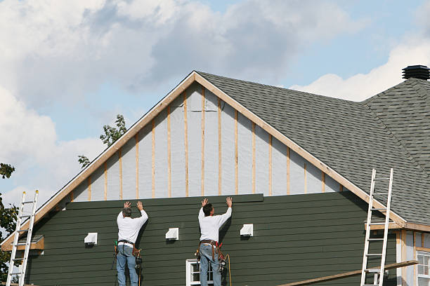 Professional Storm Damage Siding Repair technician working in Corning, NY